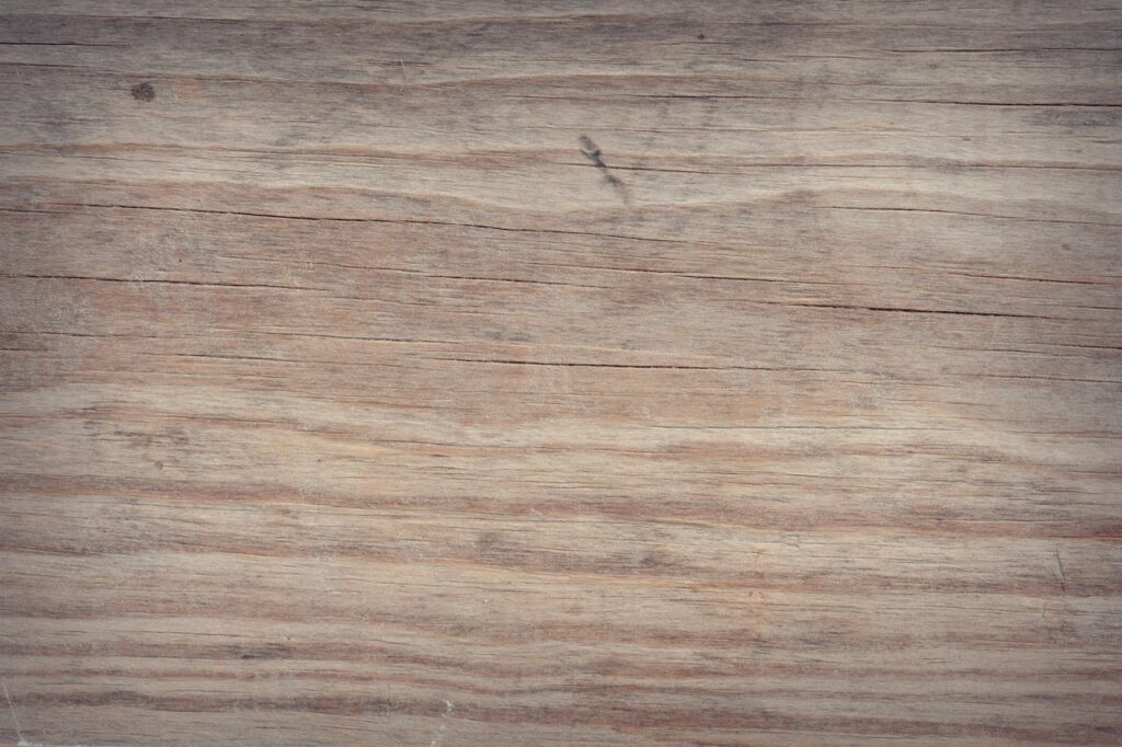 A detailed view of a rustic, weathered wood texture, perfect for backgrounds.